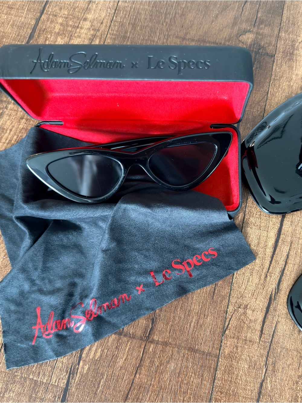Le Specs Black Cat-Eye Sunglasses with Red Case Lining